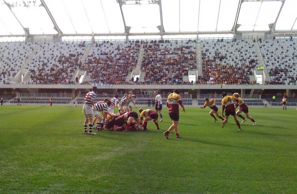 Players from the Knox and Selwyn College university rugby teams play the first game at the...