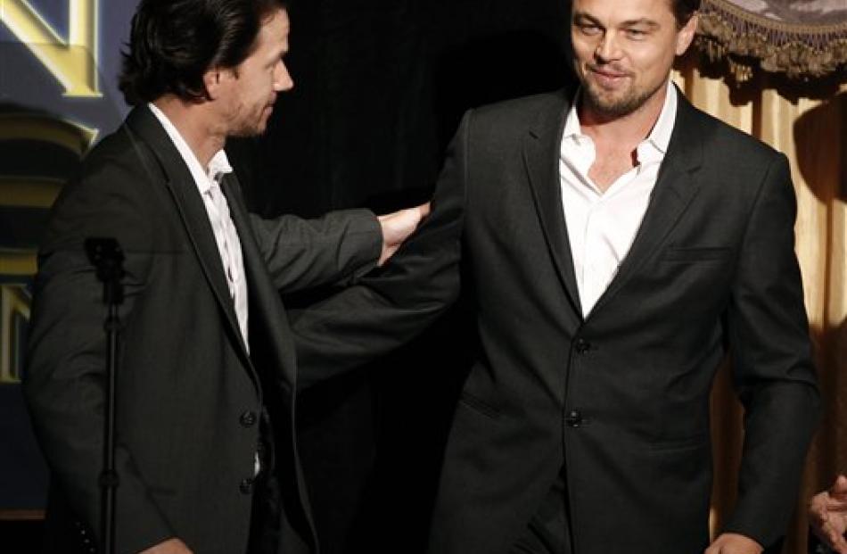 Actors Leonardo DiCaprio, right, and Mark Wahlberg greet each other at the Hollywood Foreign...