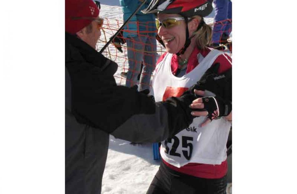 Glenorchy resident Katherine Cahill, of Paradise Power House, is congratulated by race director...