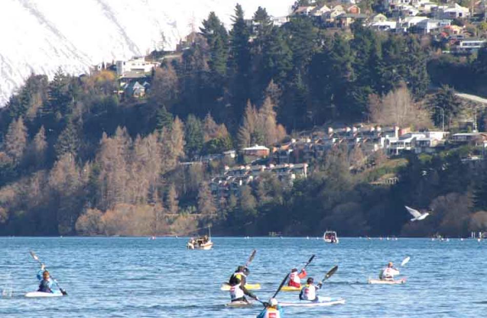 Peak to Peak competitors take to Lake Wakatipu on kayaks.