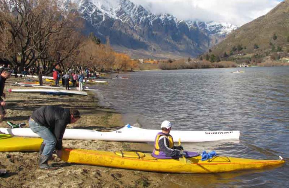Competitors switch from mountain bikes to kayaks for stage three.