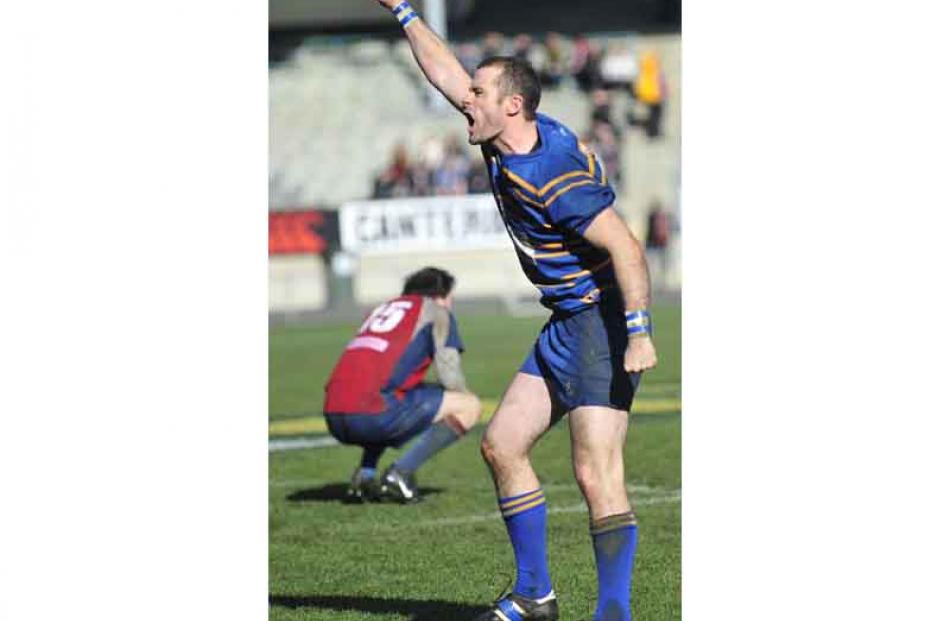 Taieri number 21 Mike Kerr celebrates.