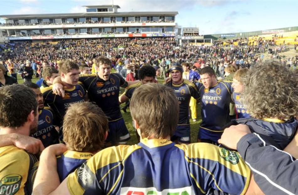 Otago players gather in a huddle after being beaten 19-12 by Southland in the last game at...