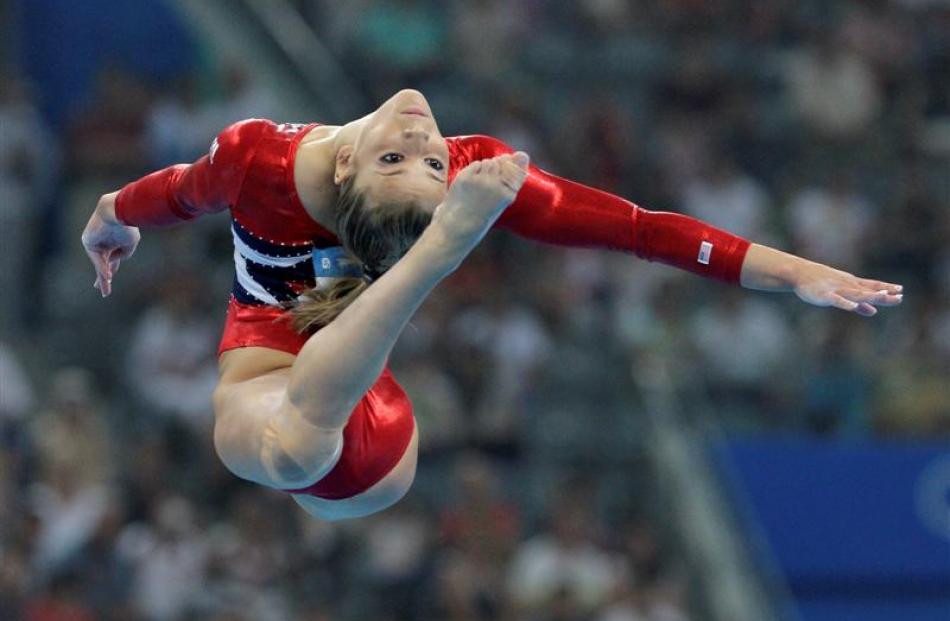 US gymnast Alicia Sacramone performs her floor routine during the women's qualification rounds. ...
