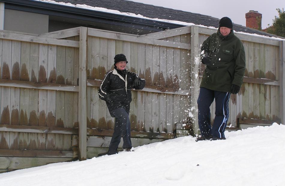 Big kids, Shirley and Craig Jones, have a snow fight.Photo by Glenda Paterson.