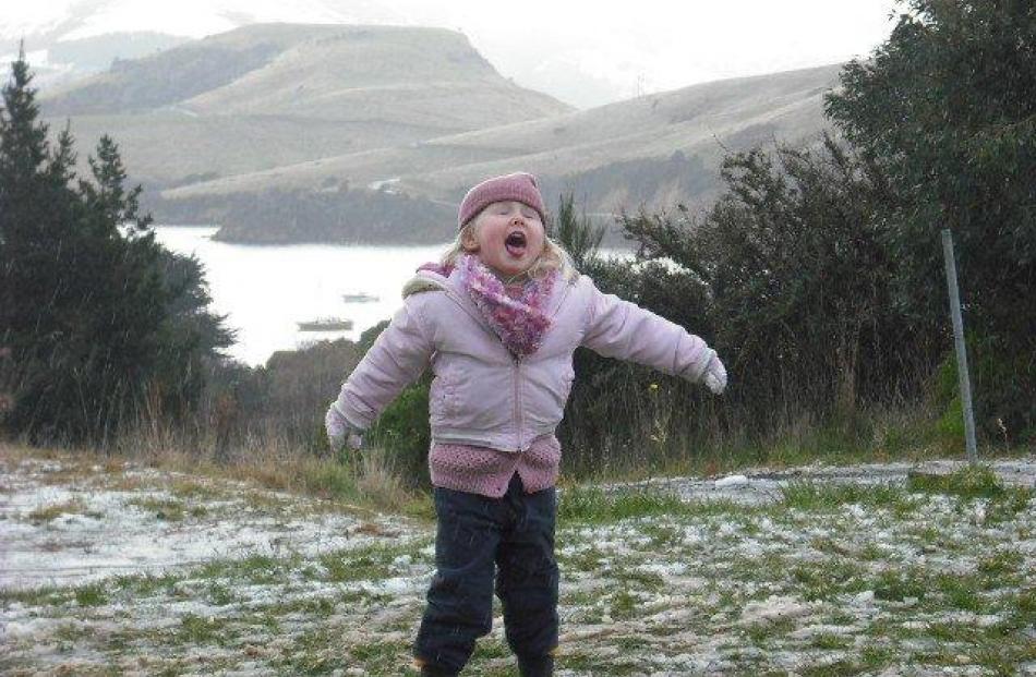 Brooke Patrick (4) catches snow at Portobello. Photo by Melissa Bulger.