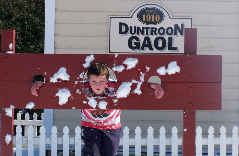 Duntroon resident Tom Trusler takes a pelting at the Duntroon Gaol. Photo Karan Lawrence