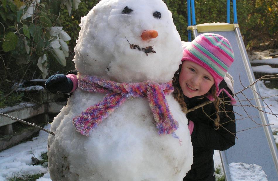 Jenna Paterson and her snowman in Waverley. Photo by Glenda Paterson.
