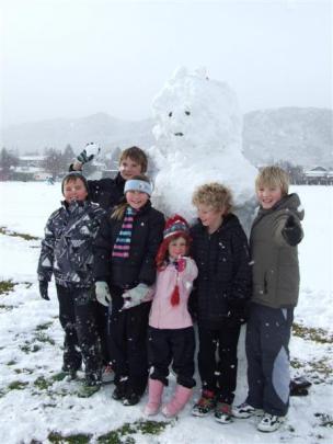 This snowman in Pioneer Park, Alexandra, was made by (from left) Hunter Smith (10), Hadley Jury ...