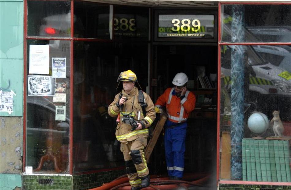 Firefighters leave the building.