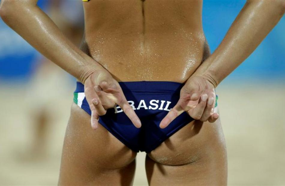 Brazil's Larissa Franca gestures during a women's beach volleyball game against Russia.  Brazil...