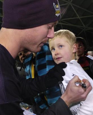 Jimmy Downey signs a shirt for Hamish Mair (8).