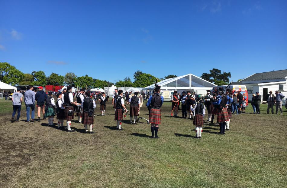 The Ellesmere Highland Pipe Band warms up before the grand parade.