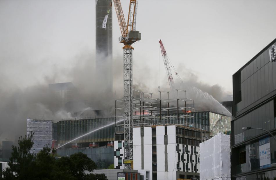 Firefighters continue to tackle the out-of-control blaze at the SkyCity Convention Centre this...