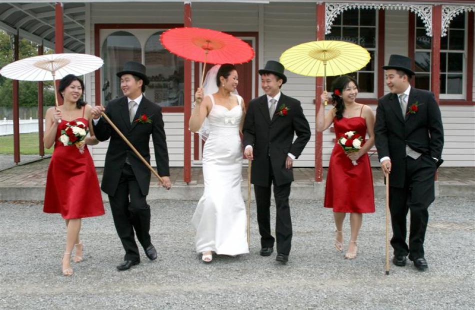 Philippa Young and Jordan Yee and their wedding party in Oamaru in March. Photo by Moira Clark, M...