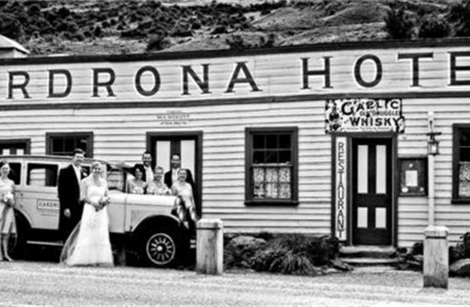 Hayden Fry and Louise Horrell and their attendants at their wedding at the Cardrona in January....
