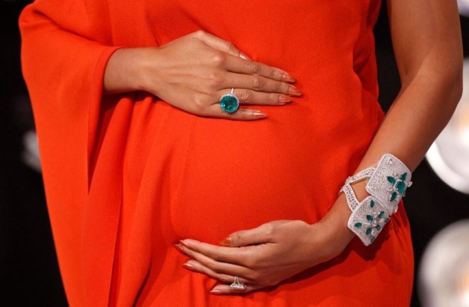 Singer Beyonce shows off her baby bump at the MTV Video Music Awards. REUTERS/Danny Moloshok