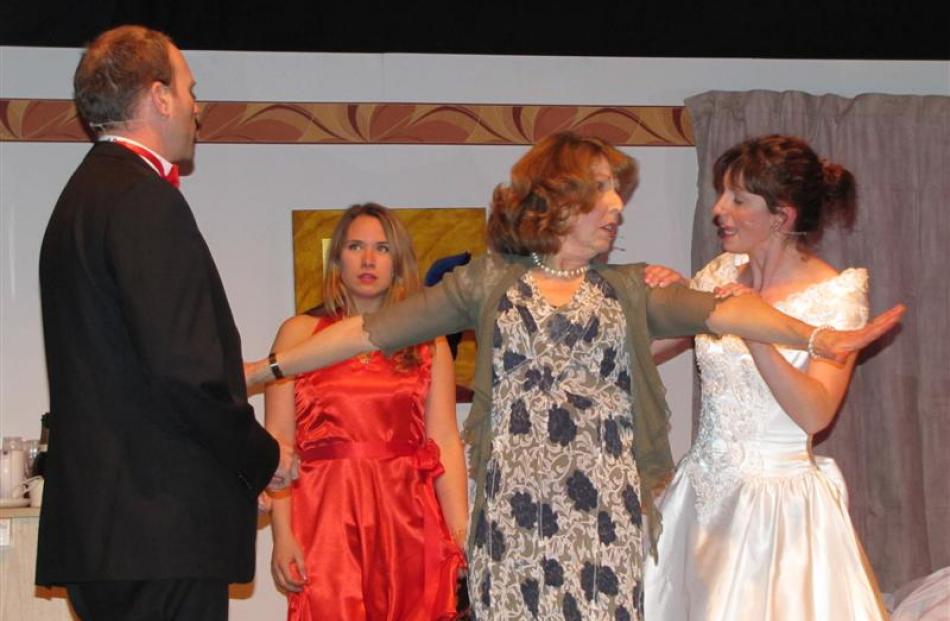Jill Derbie (second from right), as the mother of the bride, is determined her daughter Meg ...