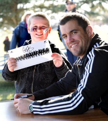 Jack Brogan (10) shows his poster signed by Cory Flynn.