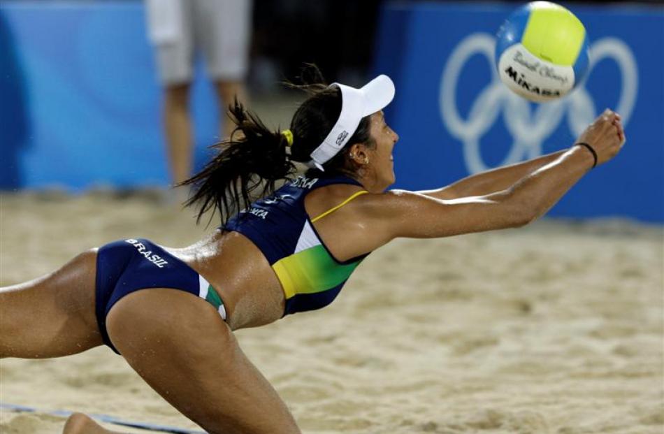 Renata Ribeiro from Brazil streatches for the ball  while playing against Australia in the beach...