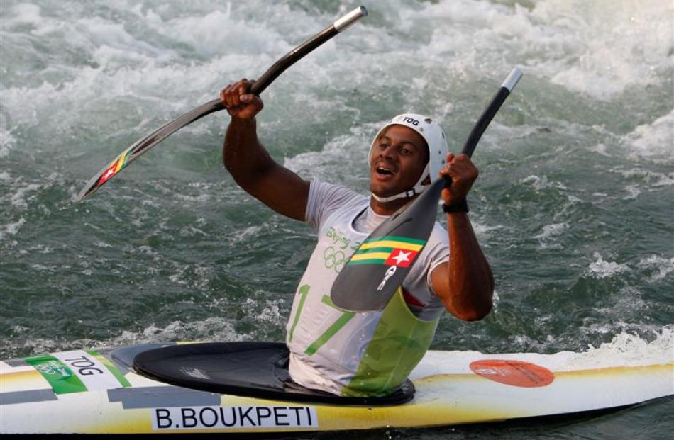 Togo's Benjamin Boukpeti celebrates after taking bronze - his country's first Olympic medal - in...