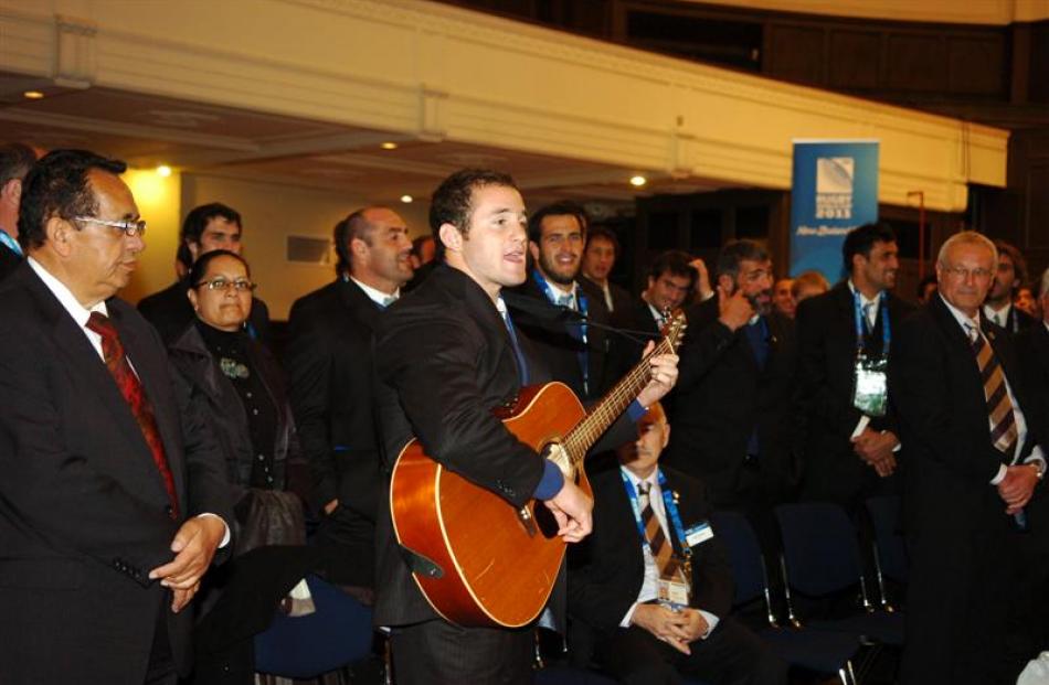 Pumas wing-centre Agustin Gosio leads his team in a song during their official capping ceremony....