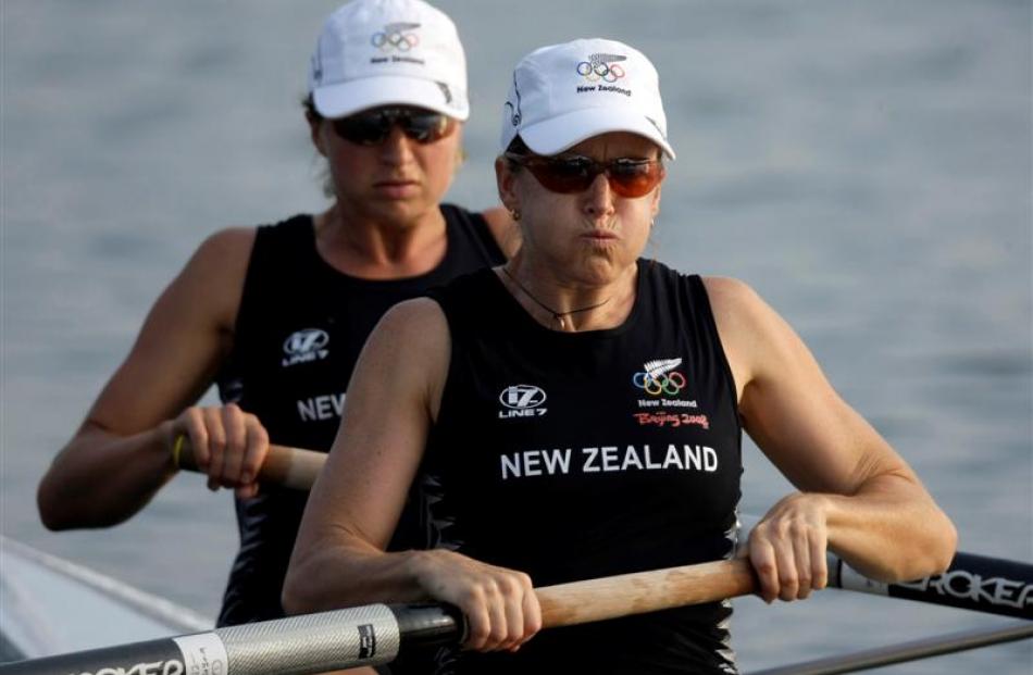 New Zealand's Nicola Coles, right, and Juliette Haigh power their boat to win their women's pair...