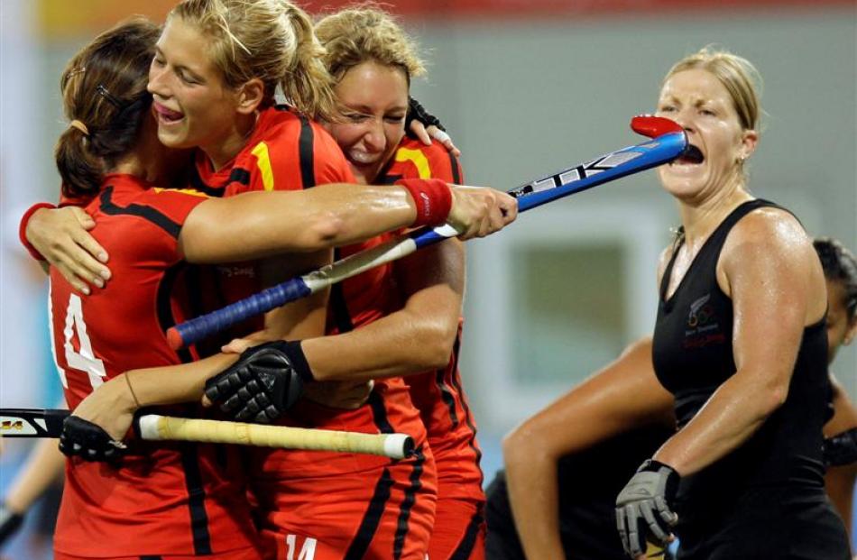 Germany's Katherina Scholz, second from left, celebrates a goal with her teammates as New Zealand...