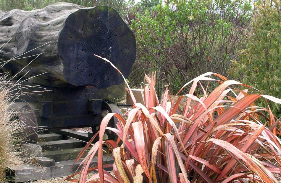 An old log forms a natural artwork in a Southland garden. 