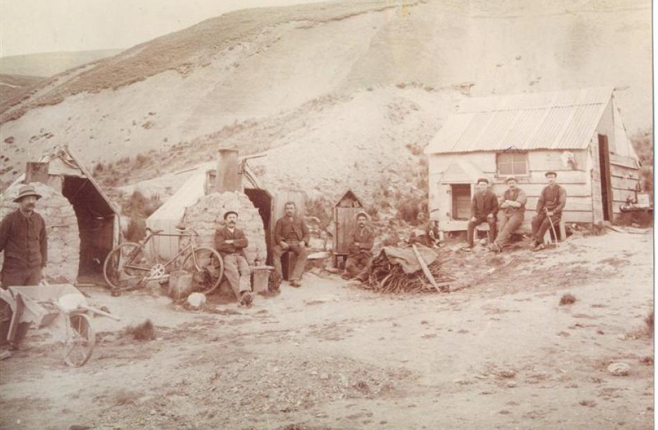 Gold workers at the dredge camp in the upper Nevis Valley in 1903 (from left) Johnston, E....