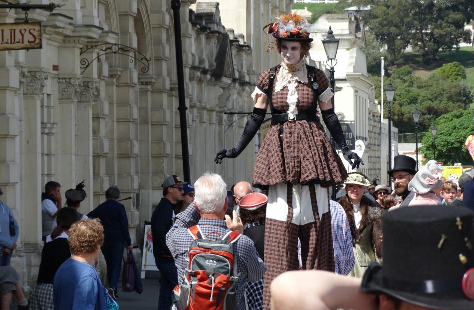 Adrianne Carthew, of Hamilton, towers above the crowd at the fete.