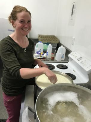 Stephanie Moore keeps an eye on the bechamal sauce.