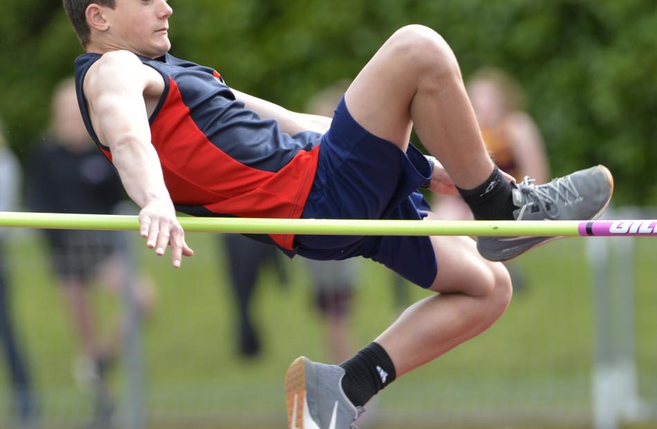 Liam Barron, of Balmacewen Intermediate, clears the bar in the 13 and over boys high jump.