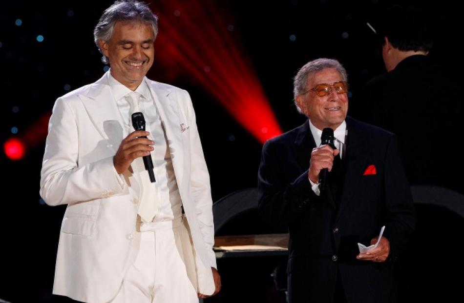 Italian tenor Andrea Bocelli (L) performs with singer Tony Bennett and the New York Philharmonic...