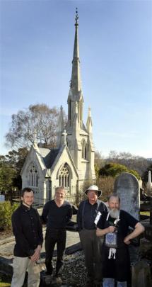 Marcus Wainwright, Guy Williams, Stewart Harvey and Peter Mackenzie in front of the restored tomb.