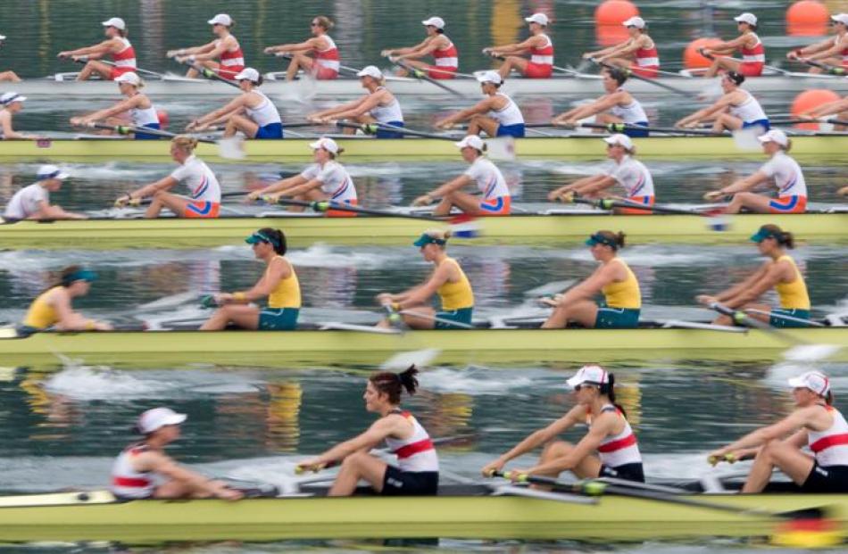 Canada's women's eight team, top, start the women's eight rowing repechage along with Great...