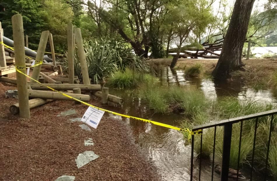 Part of the children's playground in Queenstown Bay was closed yesterday after being partly submerged by Horne Creek. Photo: Guy Williams