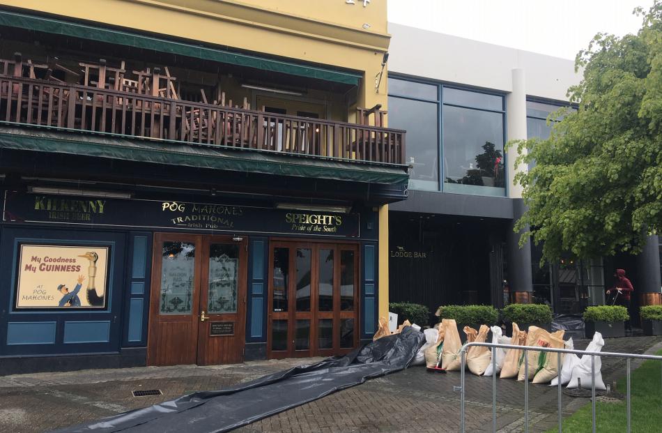 Some Queenstown businesses have put some sandbags in place. Photo: Louise Scott