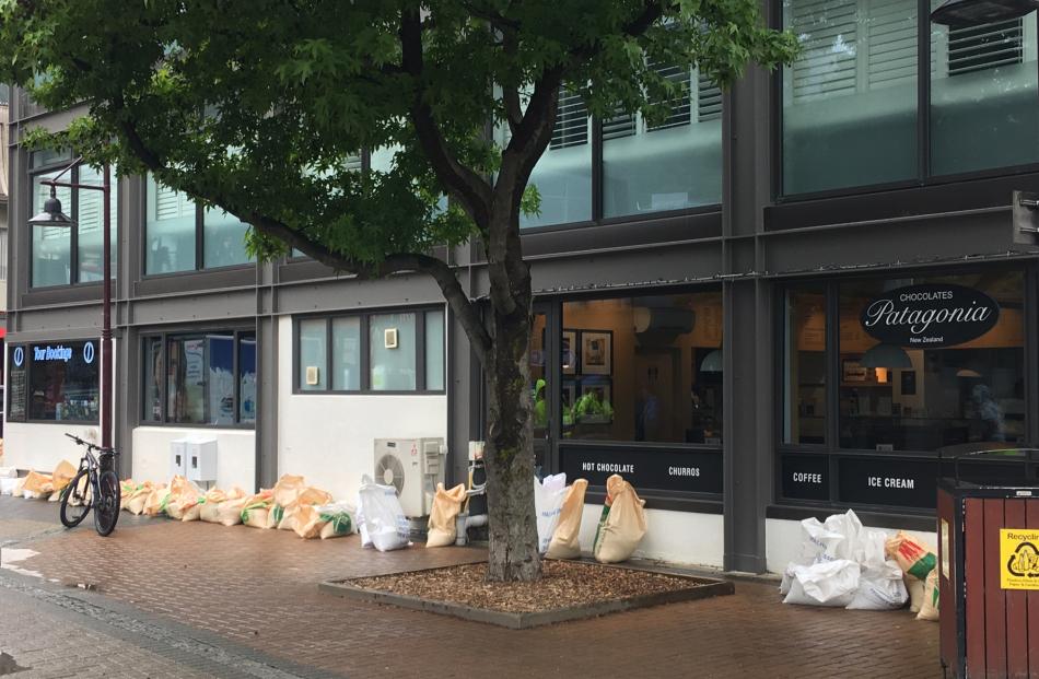 Some Queenstown businesses have put some sandbags in place. Photo: Louise Scott
