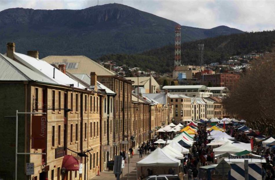 Shoppers explore the historic Salamanca Markets where food, clothes and  crafts are on offer....