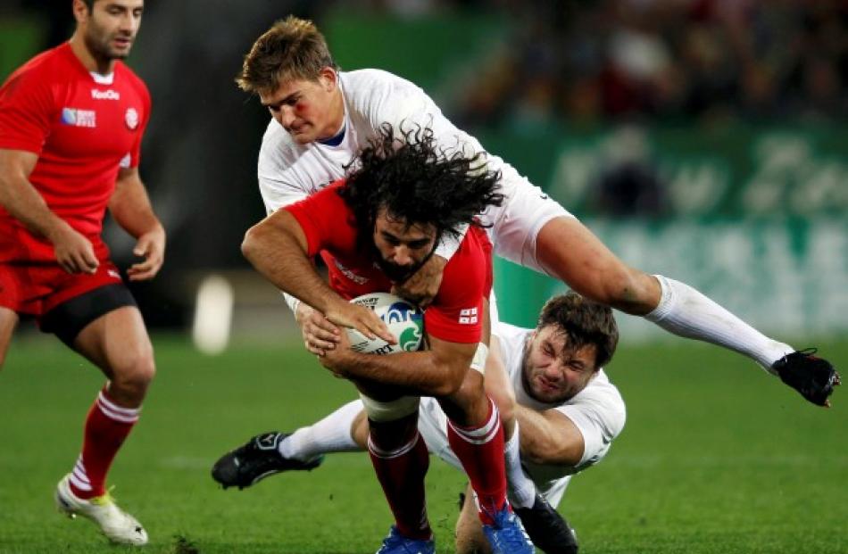 England's Toby Flood (top) tackles Georgia's Givi Berishvili. Photo: REUTERS/Stefan Wermuth