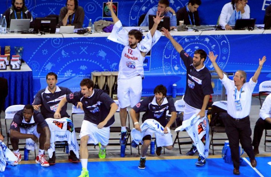 Spanish players celebrate their team's victory over France in their FIBA EuroBasket 2011 final in...