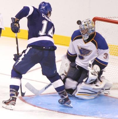 The Tampa Bay Lightning's Brett Connolly deflects a shot over the head of St. Louis Blues goalie...