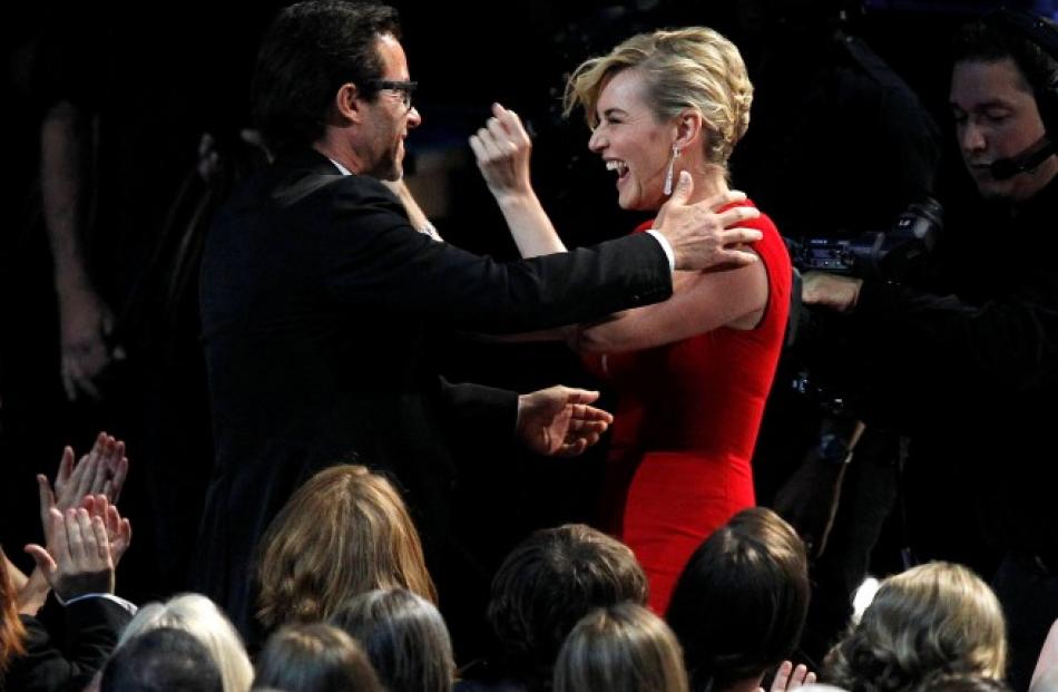 Kate Winslet reacts after her co-star Guy Pearce won outstanding supporting actor in a miniseries...