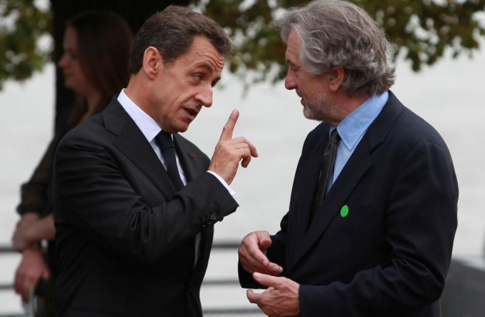 French President Nicolas Sarkozy talks to actor Robert De Niro before an event to celebrate 125...