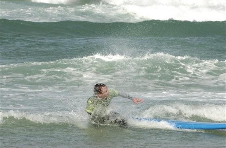 Surf's up for Hamish McNeilly at St Clair. Photos by Jane Dawber.