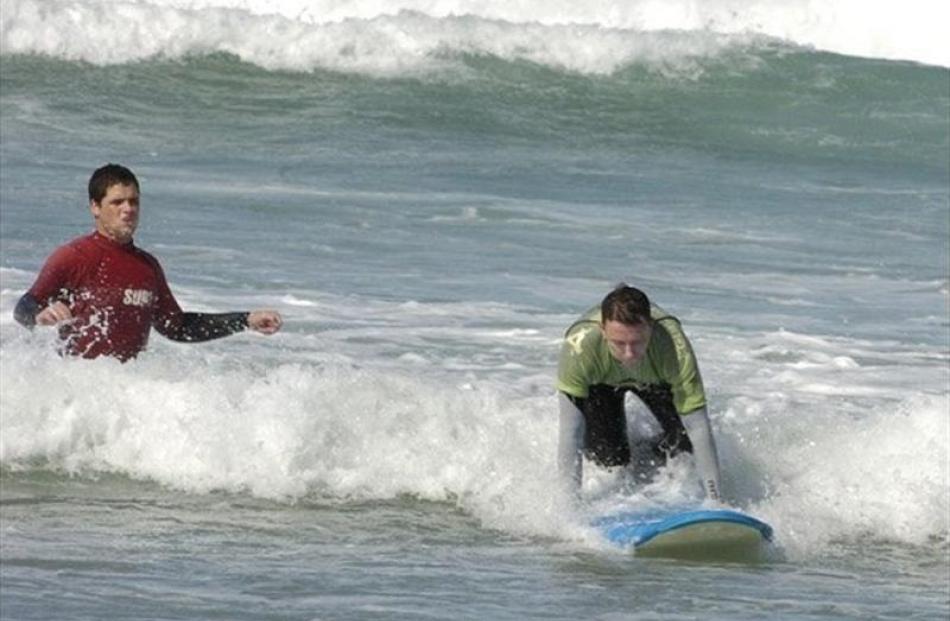 Surf's up for Hamish McNeilly at St Clair. Photos by Jane Dawber.