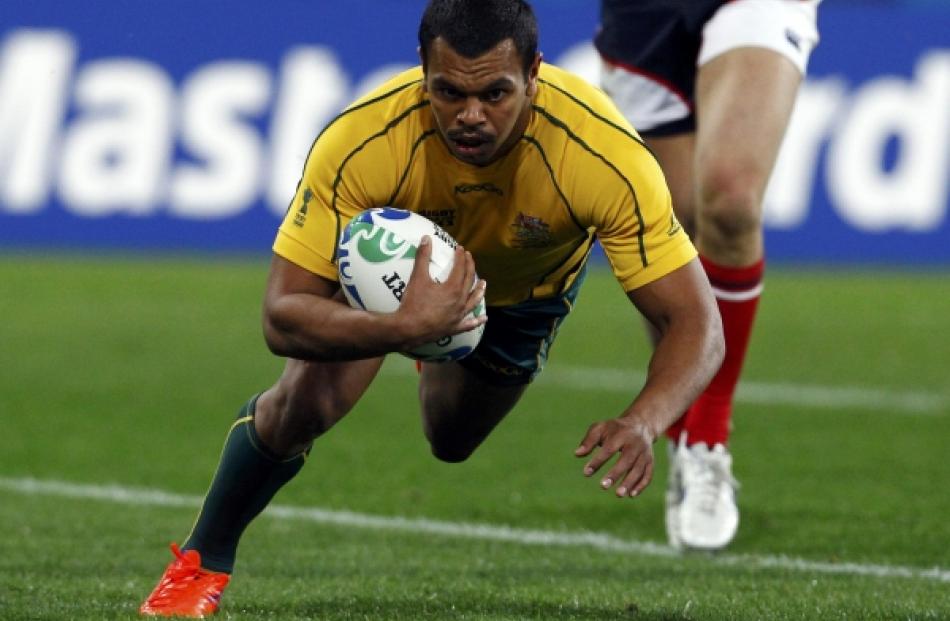 ustralia Wallabies' Kurtley Beale scores a try during their Rugby World Cup Pool C match against...