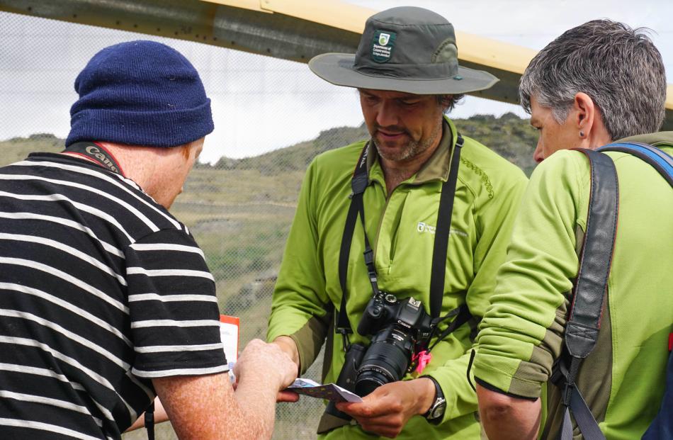 The team (from left) Carey Knox, Patrick Liddy and Amanda Salt review how they will cover all the...