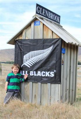Ted Williamson (3), from Glenbrook Station, between Omarama and Twizel, shows his support for the...